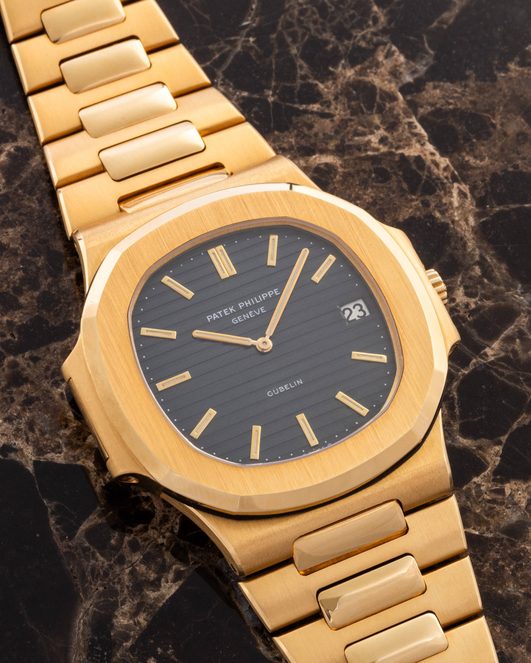 Patek Philippe Nautilus in yellow gold with a Gübelin-signed dial, close-up